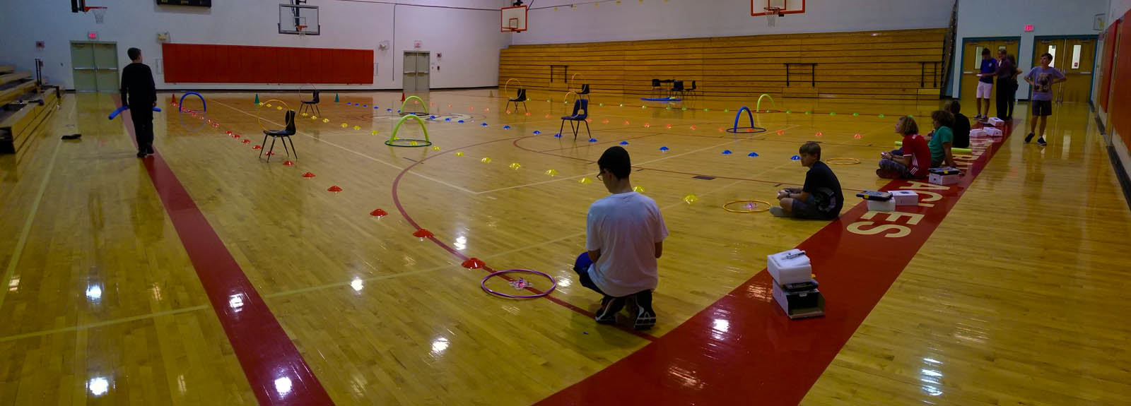Drones flying in gym